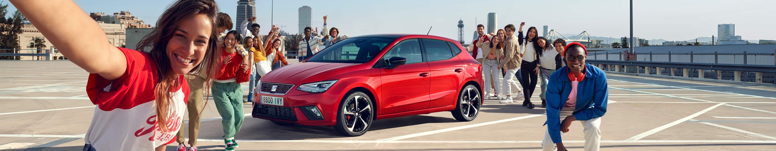 Party of friends with the SEAT Ibiza desire red colour in the middle