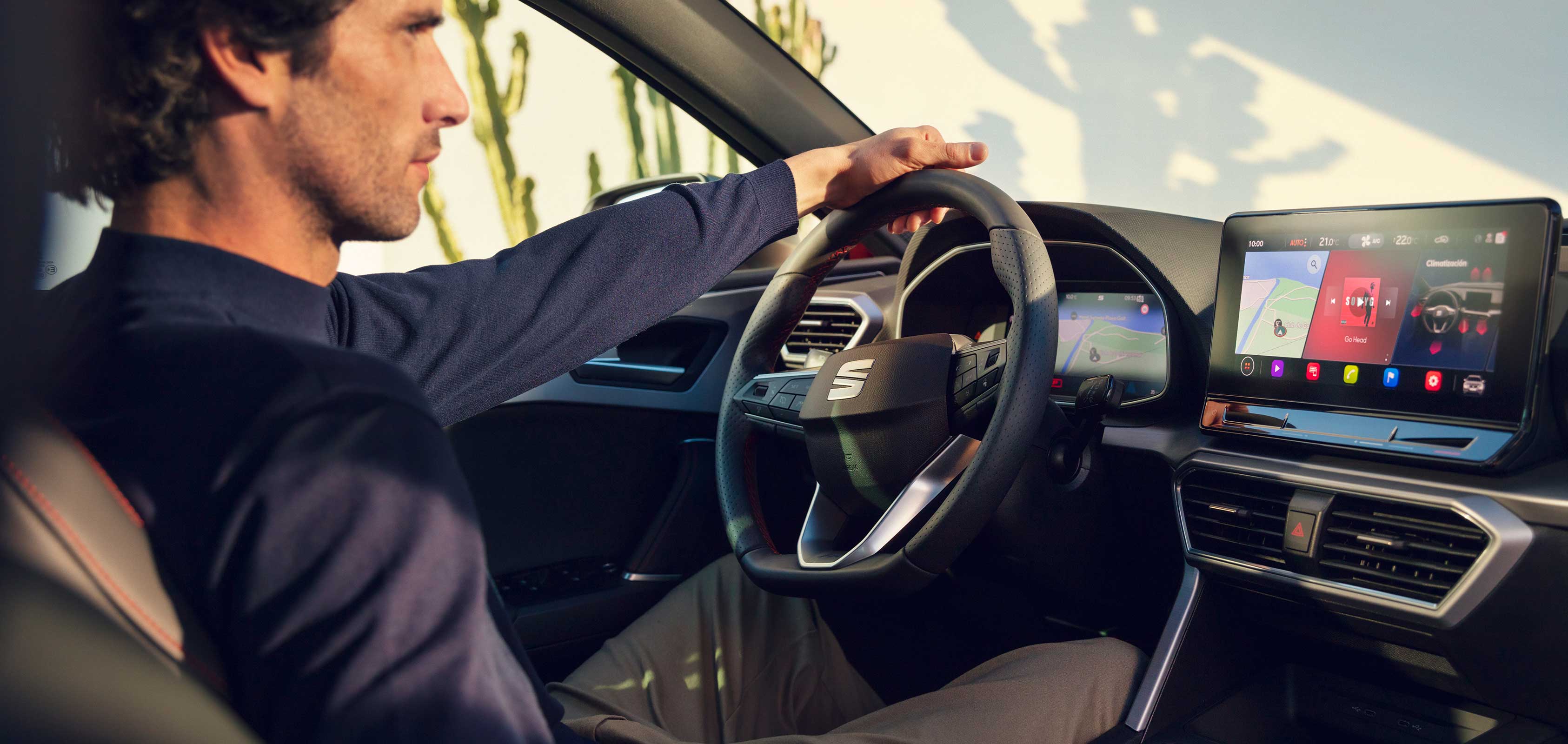 New SEAT Leon Sportstourer driver in cockpit charging phone