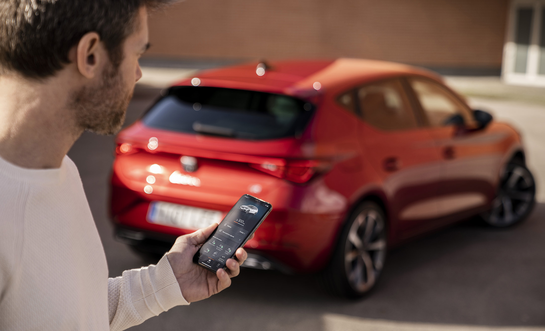 New SEAT Leon Sportstourer person holding phone with app