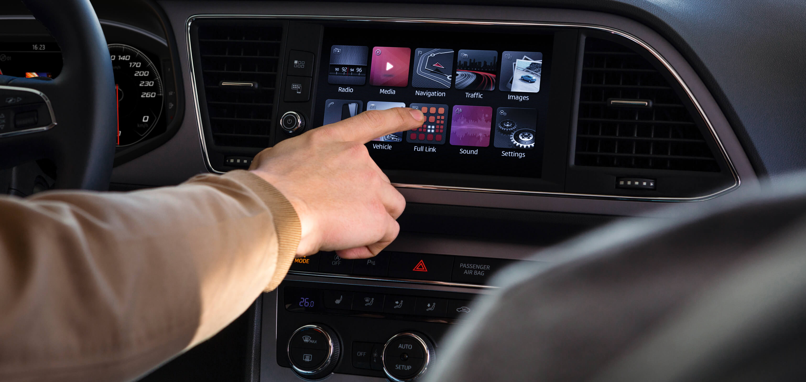 SEAT new car services and maintenance – driving pushing a button on the Navi System sat nav dashboard